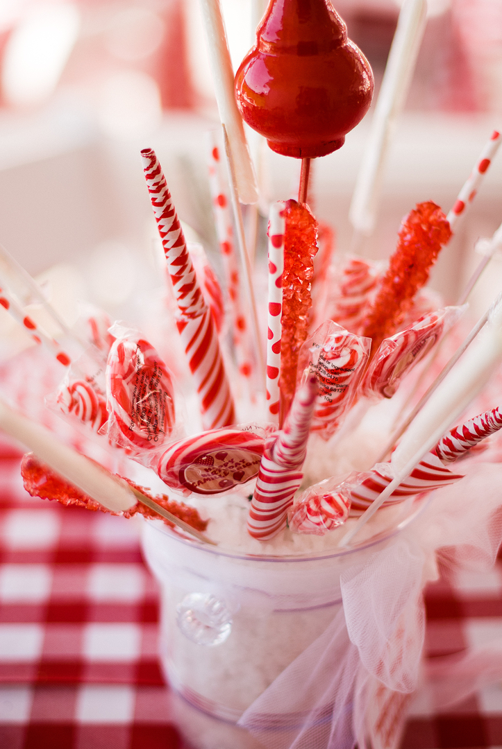 A close up of candy canes in a cup
