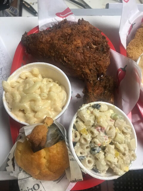 A plate of food with macaroni and cheese, mac and cheese, macaroni salad, fried chicken.